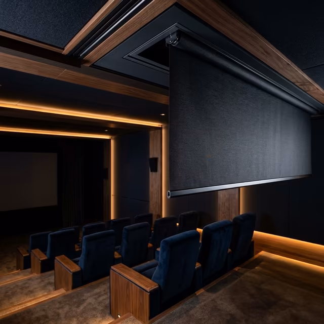 La Grange Window Coverings motorized blackout shades with recessed shade pockets and sub-25 dBA operation in a luxury home theater, Sonoma County