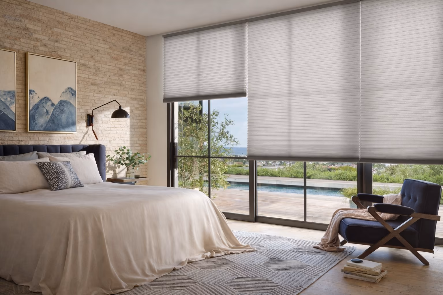 Hunter Douglas Silhouette Window Shadings on large bedroom windows providing light filtering with pool and garden views visible through sheer vanes, installed by La Grange Window Coverings